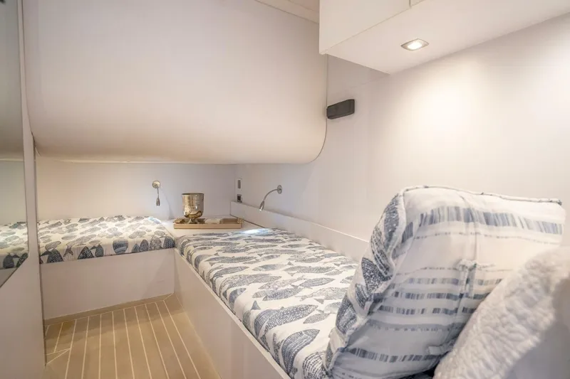 Slide: The Image of Luxurious interior cabin of 2016 VanDutch 55 yacht with cozy bedding and modern lighting. - 17