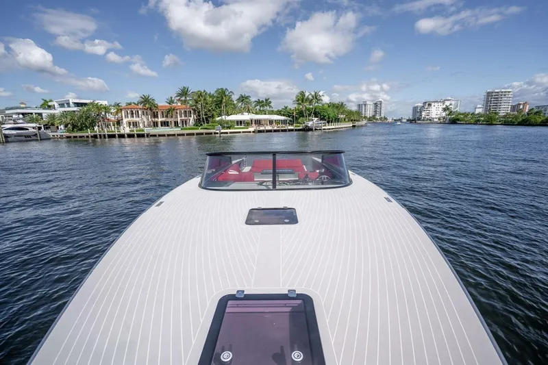 Slide: The Image of VanDutch 55 yacht cruising on a sunny day, 2016 model, with waterfront view. - 6