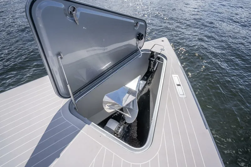 Slide: The Image of Open anchor compartment on 2016 VanDutch 55 yacht, with visible water background. - 7