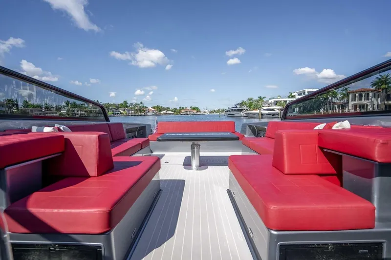 Slide: The Image of Luxurious 2016 VanDutch 55 yacht with red seating, cruising on a sunny day. - 9