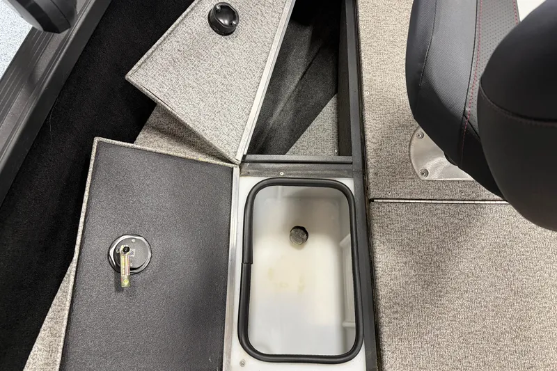 Slide: The Image of 2023 Alumacraft Competitor 185 Tiller boat interior with storage compartments and seating. - 10