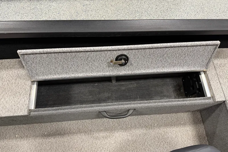 Slide: The Image of Open storage compartment in 2023 Alumacraft Competitor 185 Tiller boat. - 14