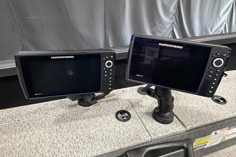 Slide: The Image of Two Humminbird Helix fish finders on a 2023 Alumacraft Competitor 185 Tiller boat. - 17