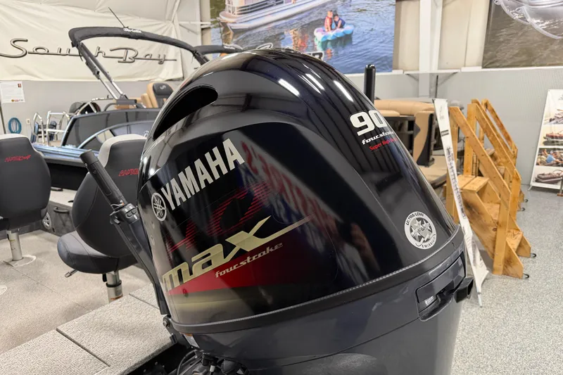 Slide: The Image of 2023 Alumacraft Competitor 185 Tiller with Yamaha 90 HP outboard motor in showroom. - 5