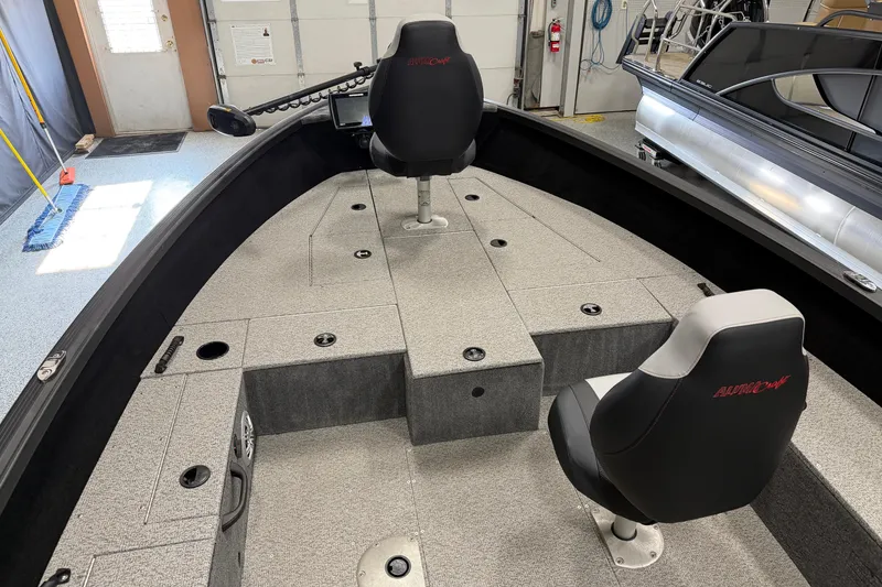 Slide: The Image of 2023 Alumacraft Competitor 185 Tiller interior with two seats and fishing deck. - 6