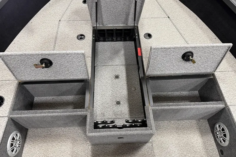 Slide: The Image of 2023 Alumacraft Competitor 185 Tiller boat interior with open storage compartments. - 8