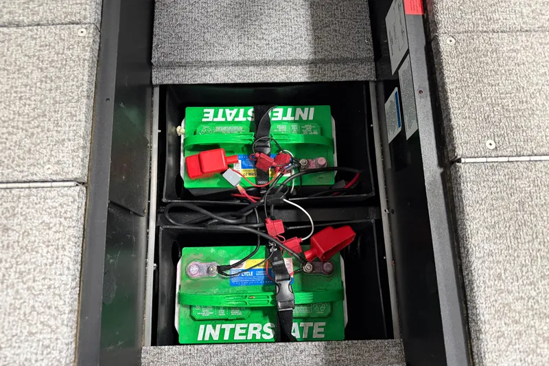 Slide: The Image of 2023 Alumacraft Competitor 185 Tiller boat batteries, Interstate brand, securely installed. - 9