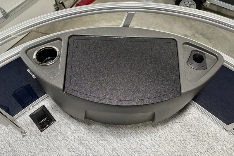 Slide: The Image of 2026 Sun Tracker BASS BUGGY® 18 DLX boat console with cup holders and storage. - 11