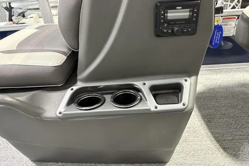 Slide: The Image of 2026 Sun Tracker BASS BUGGY® 18 DLX boat interior with cup holders and control panel. - 14