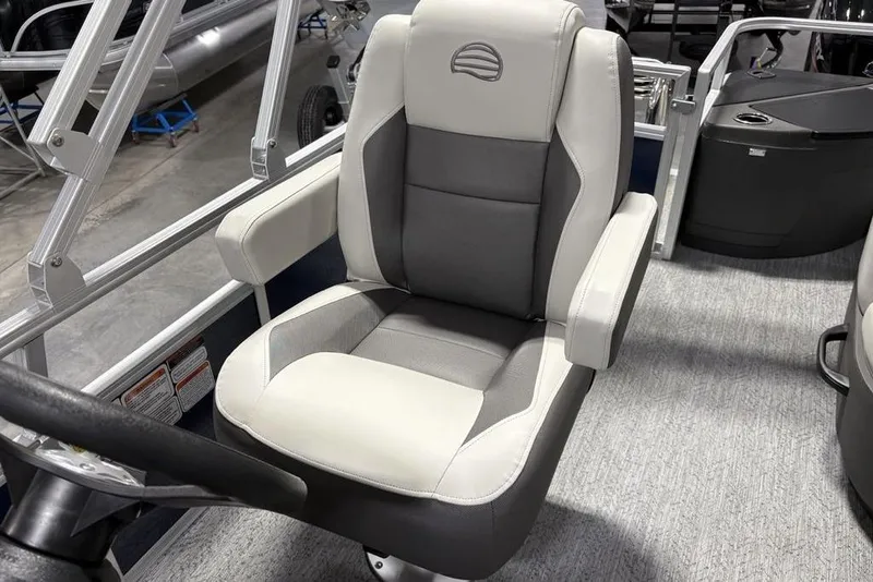 Slide: The Image of 2026 Sun Tracker BASS BUGGY® 18 DLX captain's chair, featuring gray and white upholstery. - 17