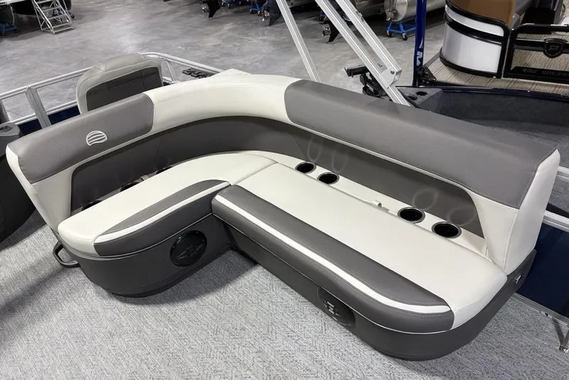 Slide: The Image of 2026 Sun Tracker BASS BUGGY® 18 DLX boat seating with cup holders, gray and white upholstery. - 18