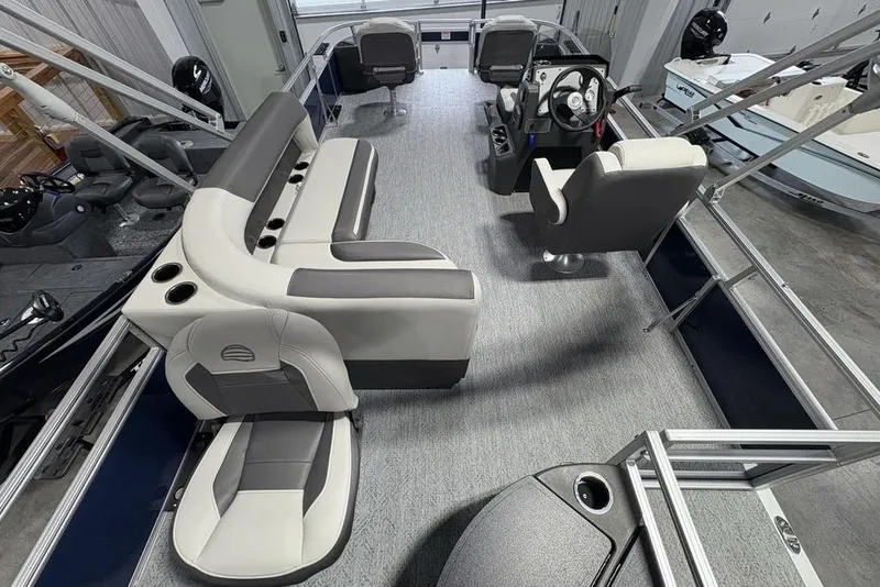 Slide: The Image of 2026 Sun Tracker BASS BUGGY® 18 DLX pontoon boat interior with seating and steering console. - 21