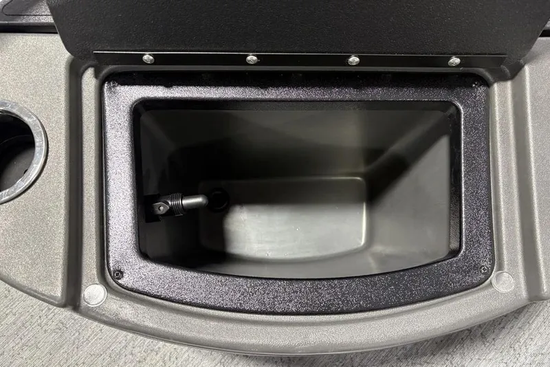 Slide: The Image of Open storage compartment on 2026 Sun Tracker BASS BUGGY® 18 DLX boat. - 23