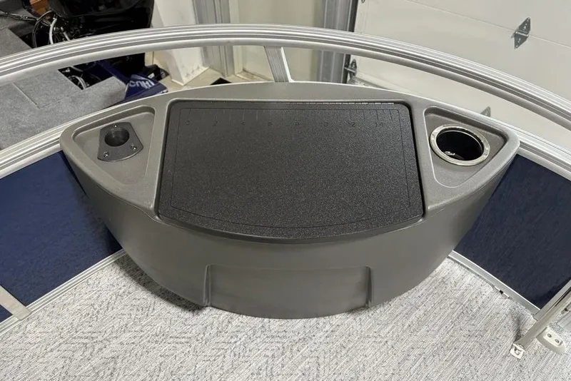 Slide: The Image of 2026 Sun Tracker BASS BUGGY® 18 DLX boat console with cup holder and storage. - 6