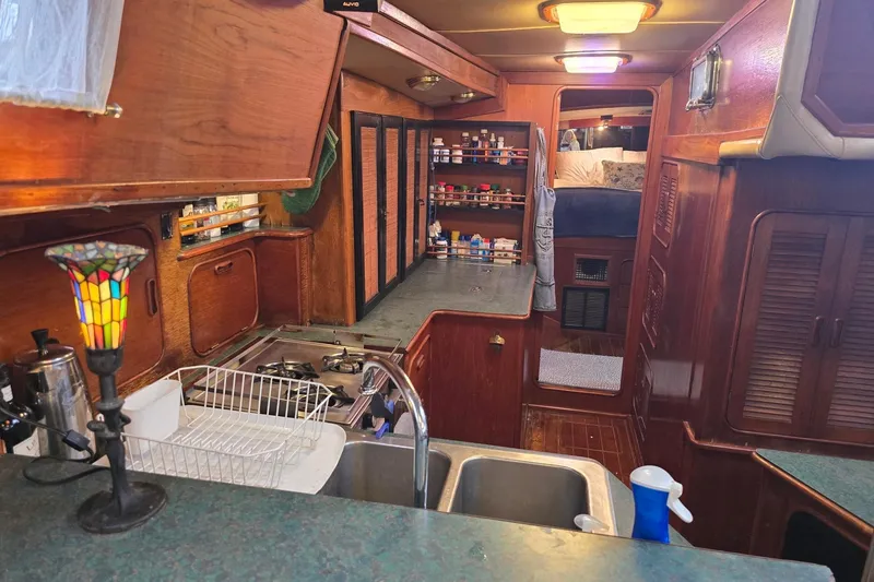 Slide: The Image of Interior of 1982 Irwin 52 sailboat with kitchen and cozy cabin area. - 12