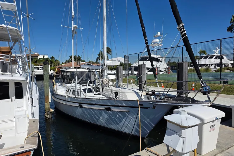 Slide: The Image of 1982 Irwin 52 sailboat docked at marina under clear blue sky. - 3