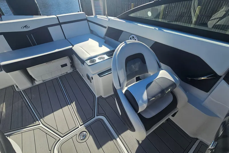 Slide: The Image of 2022 Monterey M-225 boat interior with sleek seating and modern design. - 10