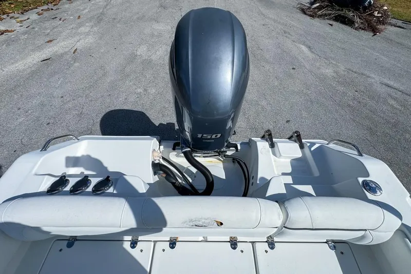 Slide: The Image of 2016 Sea Hunt Ultra 211 boat with Yamaha 150 outboard motor, rear view. - 100