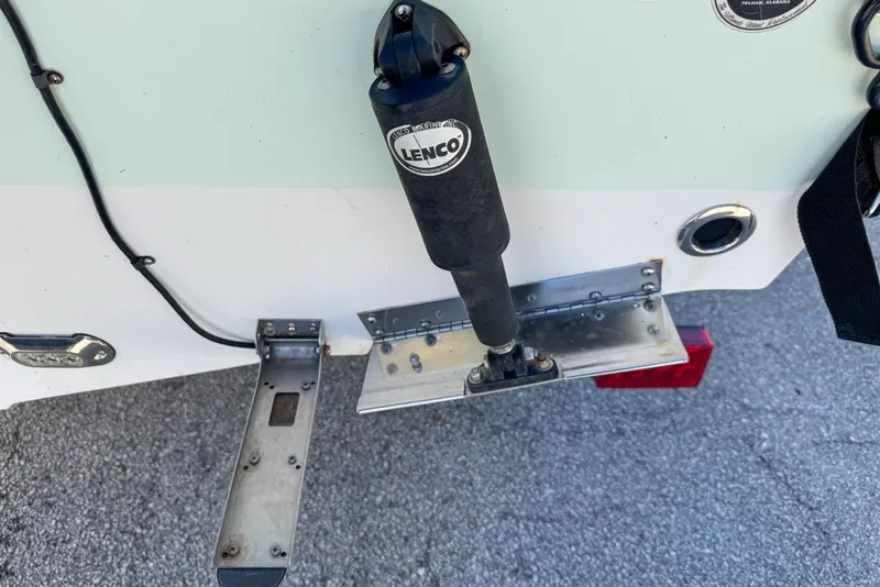 Slide: The Image of 2016 Sea Hunt Ultra 211 boat with Lenco trim tab actuator. - 111