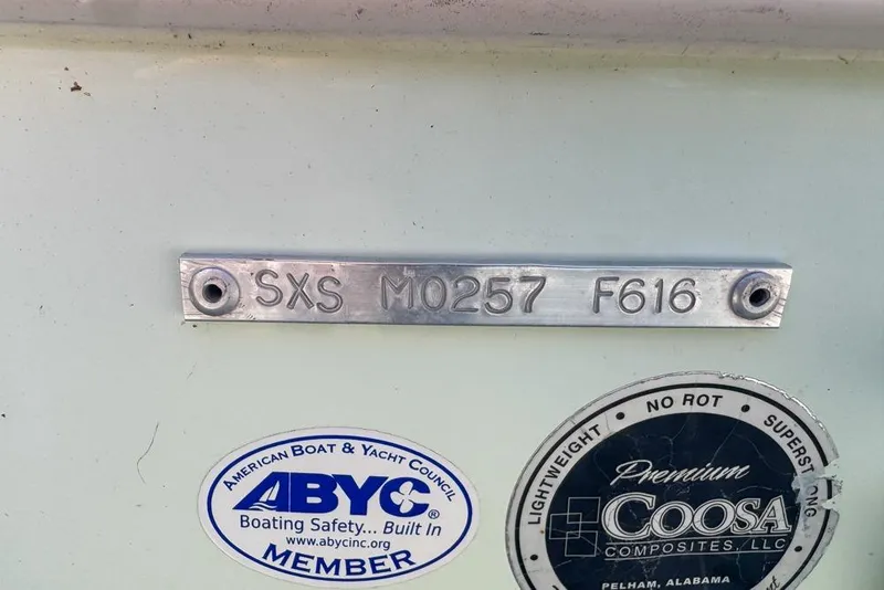 Slide: The Image of 2016 Sea Hunt Ultra 211 boat identification plate with ABYC and Coosa Composites stickers. - 112