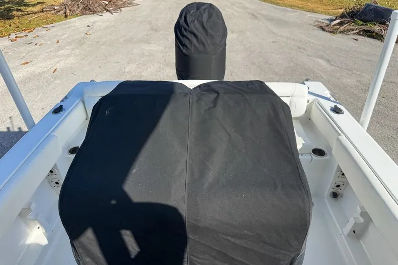 Slide: The Image of 2016 Sea Hunt Ultra 211 boat interior with black seat covers. - 118