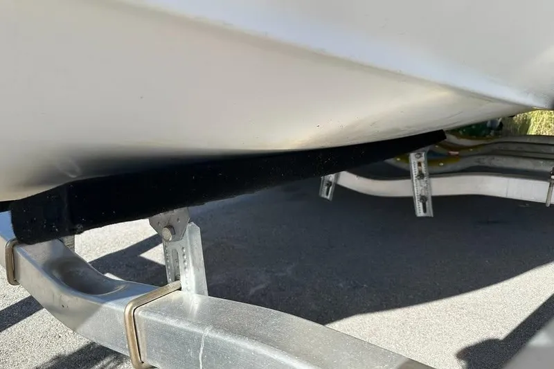 Slide: The Image of 2016 Sea Hunt Ultra 211 boat on trailer, parked in residential area. - 12