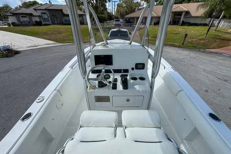 Slide: The Image of 2016 Sea Hunt Ultra 211 boat interior with steering console and seating. - 35