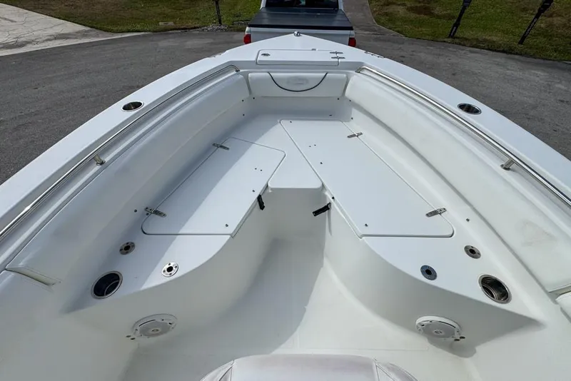 Slide: The Image of 2016 Sea Hunt Ultra 211 boat interior with spacious seating and storage compartments. - 50