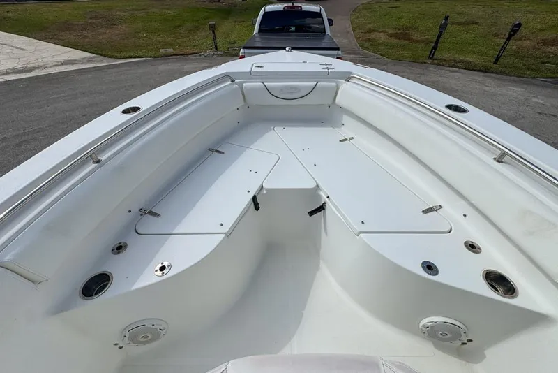 Slide: The Image of 2016 Sea Hunt Ultra 211 boat interior with seating and storage compartments. - 51