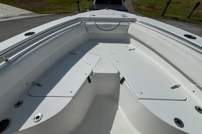 Slide: The Image of 2016 Sea Hunt Ultra 211 boat interior with spacious seating and storage compartments. - 56