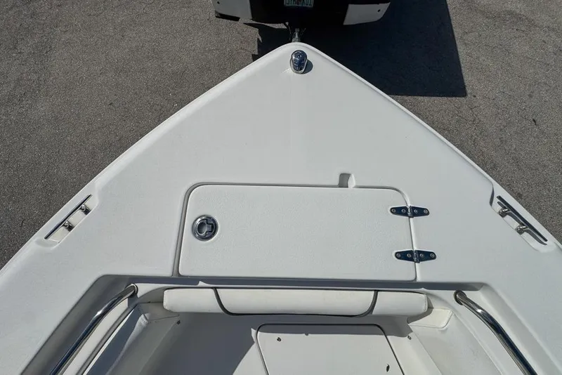 Slide: The Image of 2016 Sea Hunt Ultra 211 boat bow with storage compartment and stainless steel fittings. - 59