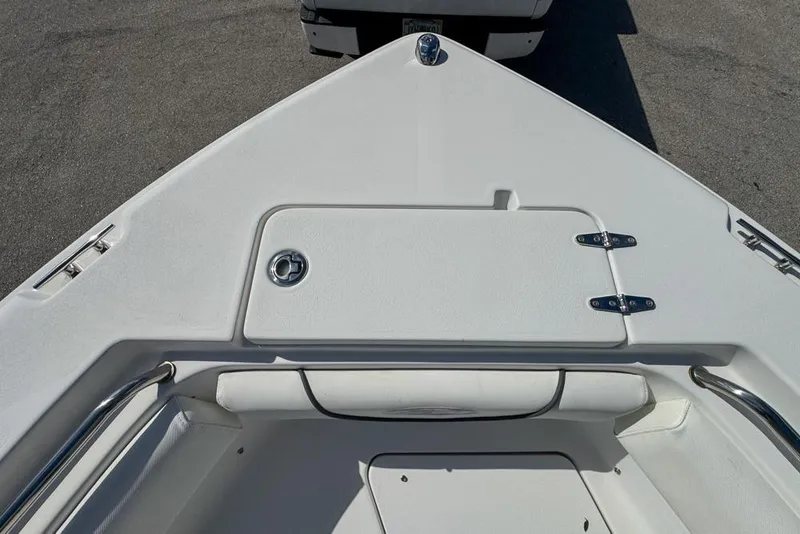 Slide: The Image of 2016 Sea Hunt Ultra 211 boat bow with storage compartment and seating. - 60