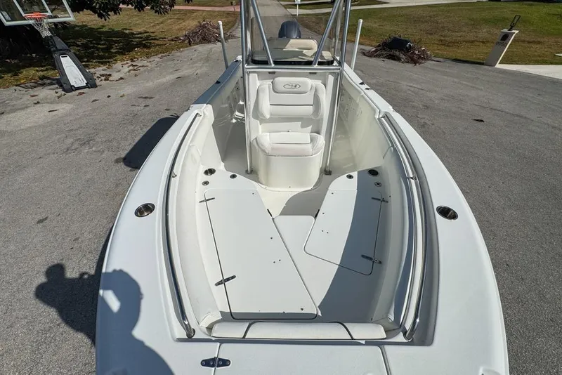 Slide: The Image of 2016 Sea Hunt Ultra 211 boat interior with seating and storage compartments. - 64