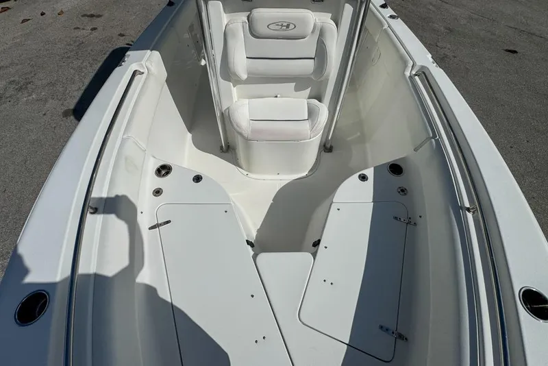 Slide: The Image of 2016 Sea Hunt Ultra 211 boat interior with seating and storage compartments. - 66
