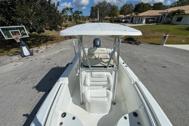 Slide: The Image of 2016 Sea Hunt Ultra 211 boat with T-top, parked on residential street. - 71