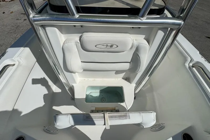 Slide: The Image of 2016 Sea Hunt Ultra 211 boat interior with seating and storage compartment. - 76