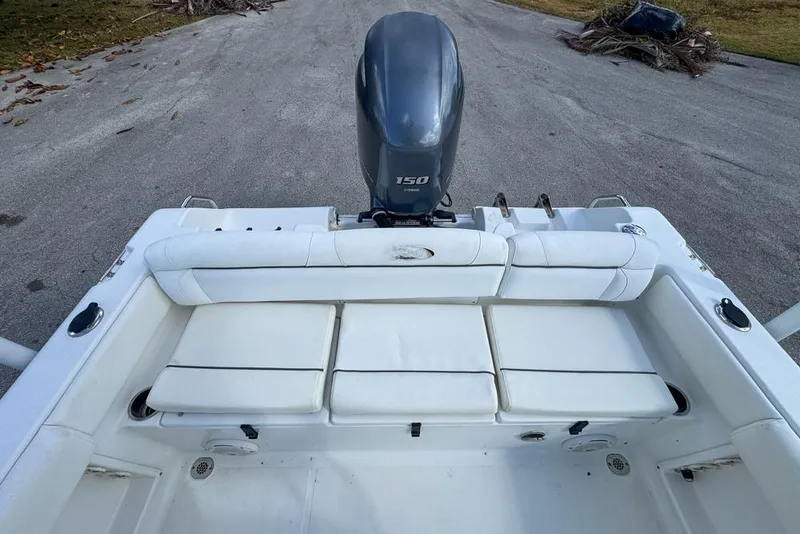 Slide: The Image of 2016 Sea Hunt Ultra 211 boat with Yamaha 150 engine, featuring spacious seating. - 86