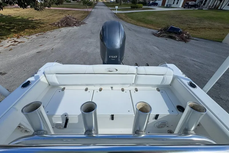 Slide: The Image of 2016 Sea Hunt Ultra 211 boat with Yamaha 150 engine, viewed from the rear deck. - 89