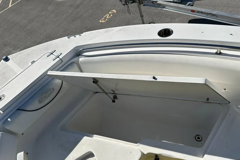 Slide: The Image of 2016 Sea Hunt Ultra 211 boat on trailer under a partly cloudy sky. - 9