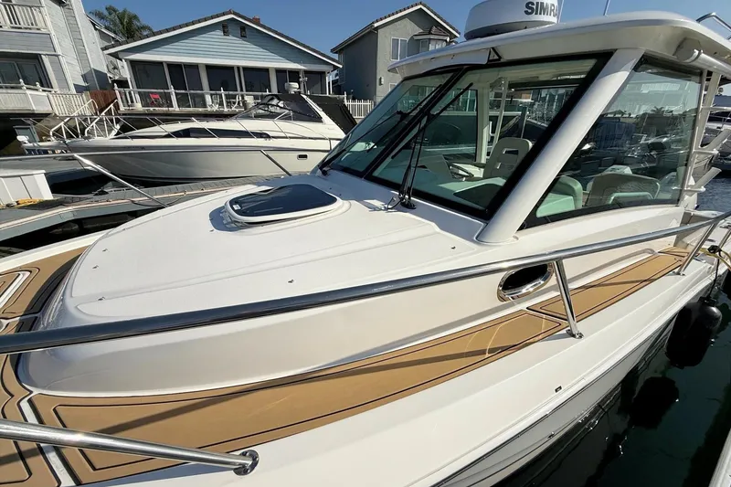 Slide: The Image of 2025 Boston Whaler 285 Conquest boat docked, showcasing sleek design and modern features. - 15