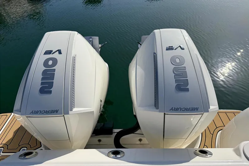 Slide: The Image of Twin Mercury 250 V8 engines on a 2025 Boston Whaler 285 Conquest boat. - 21