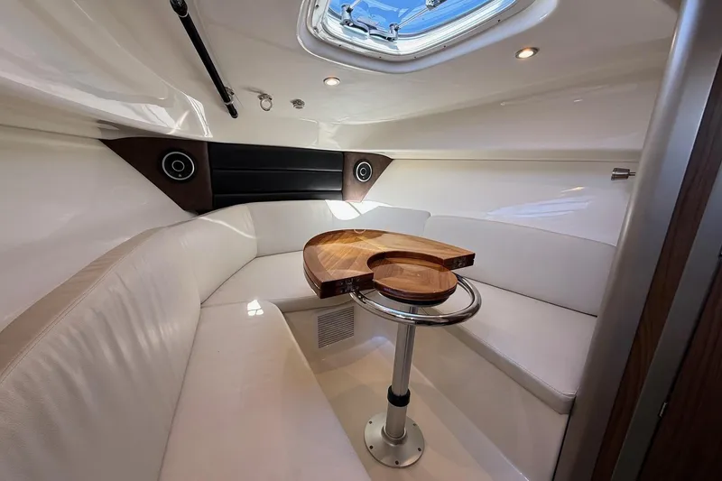 Slide: The Image of Luxurious interior of 2025 Boston Whaler 285 Conquest boat with elegant seating and table. - 44