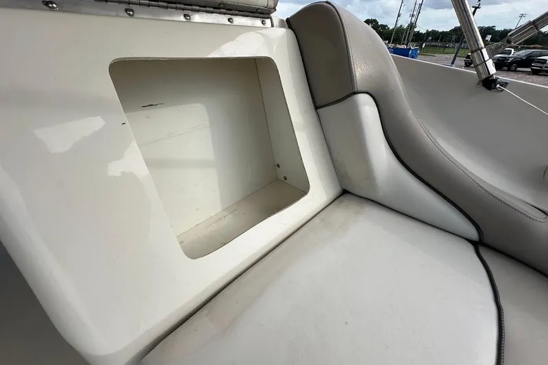 Slide: The Image of 2004 Sea Ray 270 Sundeck interior storage compartment with cushioned seating. - 39