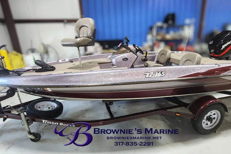 Slide: The Image of 2003 Triton Tr-165 boat on trailer at Brownie's Marine showroom. - 2
