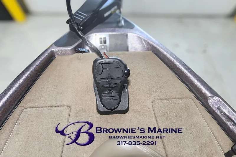 Slide: The Image of Triton Tr-165 boat deck with foot pedal, Brownie's Marine branding visible. - 4