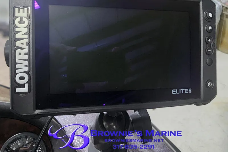 Slide: The Image of Lowrance Elite fishfinder on Triton Tr-165 boat dashboard, Browne's Marine contact info visible. - 9
