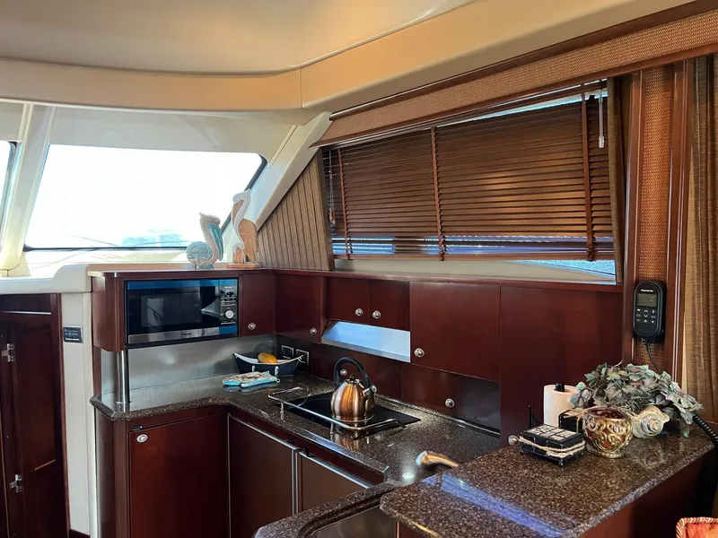 Slide: The Image of Luxurious kitchen interior of 2005 Sea Ray 500 Sedan Bridge yacht. - 10