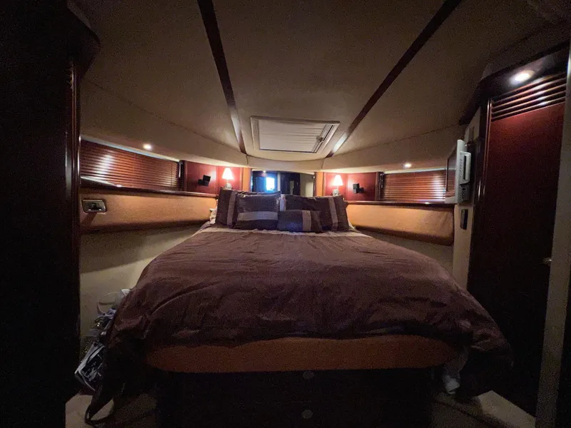 Slide: The Image of Luxurious bedroom interior of 2005 Sea Ray 500 Sedan Bridge yacht. - 19