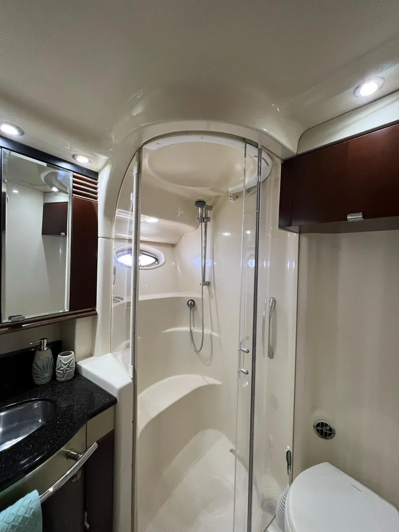 Slide: The Image of Luxurious bathroom in 2005 Sea Ray 500 Sedan Bridge yacht with modern shower and sleek design. - 22