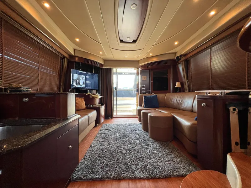 Slide: The Image of Luxurious interior of a 2005 Sea Ray 500 Sedan Bridge yacht with plush seating and modern amenities. - 24
